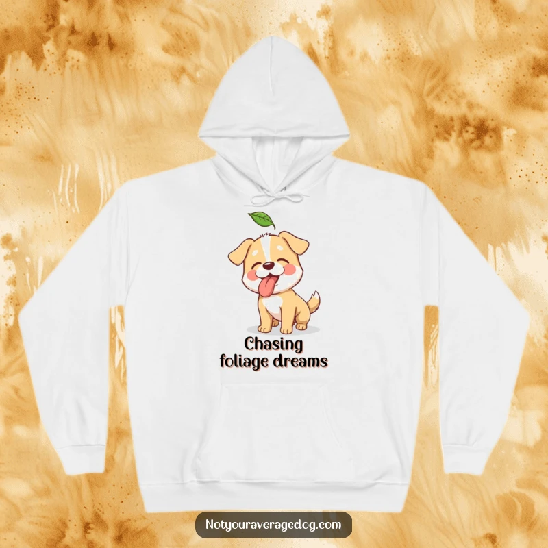 Funny hoodie depicting a determined dog comically trying to snatch a falling leaf mid-air.
