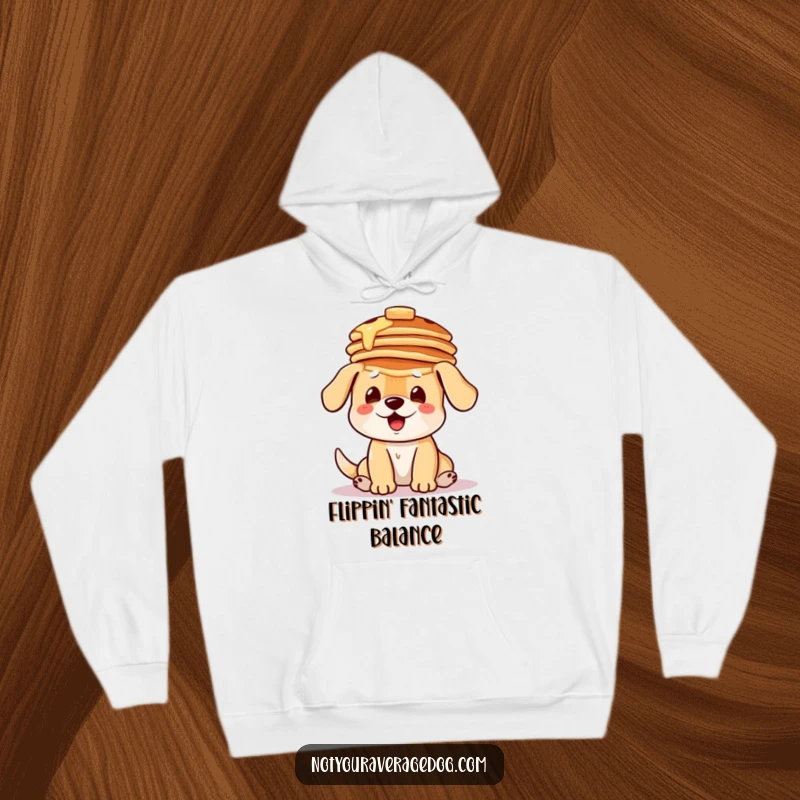 Funny hoodie featuring a dog comically attempting to balance a stack of pancakes on its head, offering cozy humor.