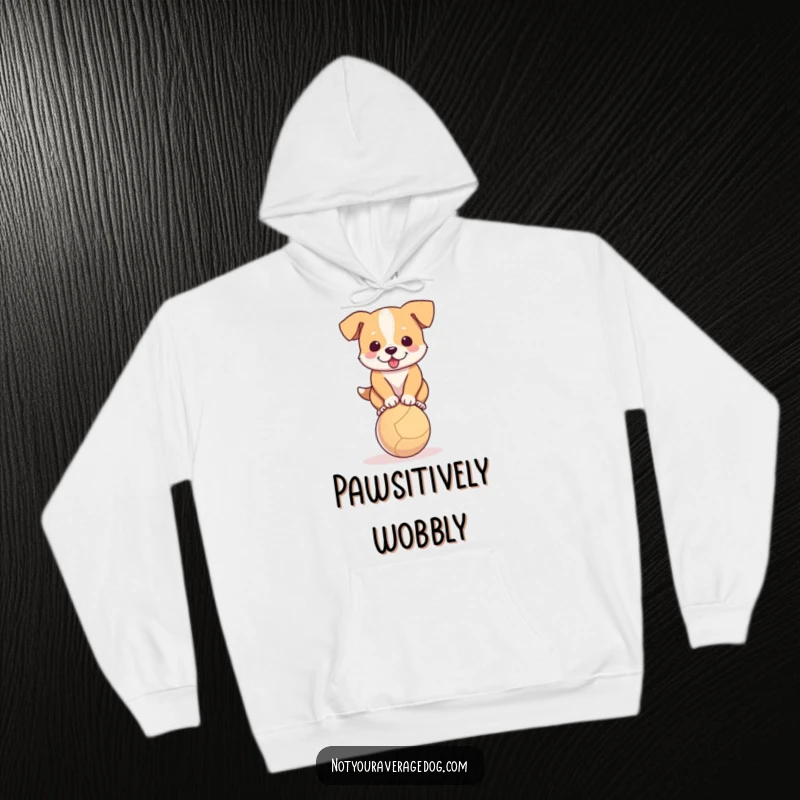 Funny hoodie featuring a determined dog trying to balance on a small ball, cozy and humorous.